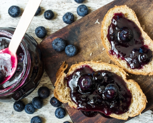 top view of healthy breakfast with blueberry jam